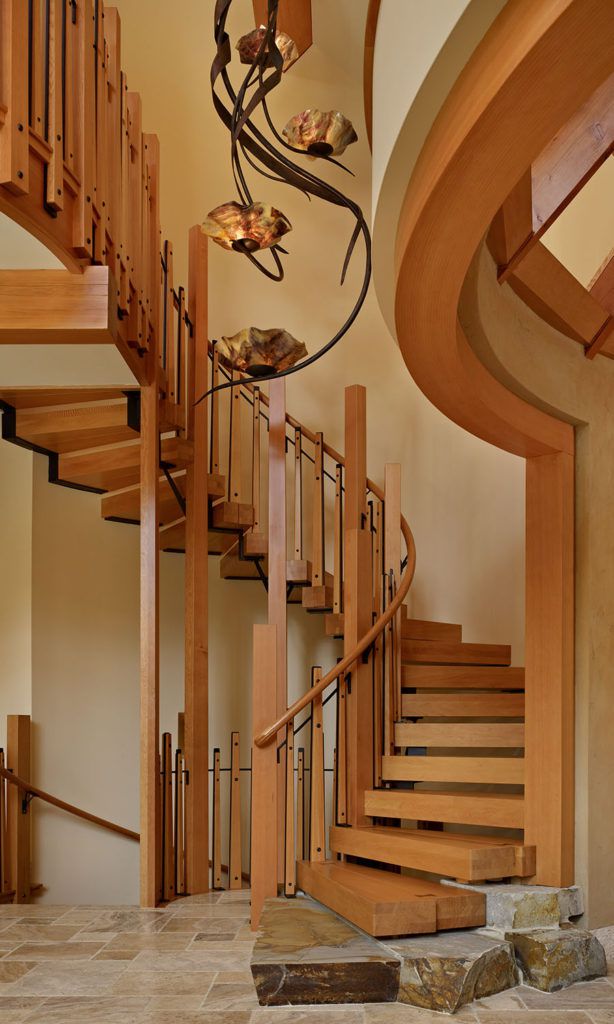 Rustic spiral staircase design in the Pacific Northwest.