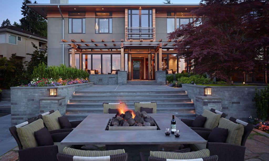 Outdoor entertaining space with dining table designed by Seattle architects.