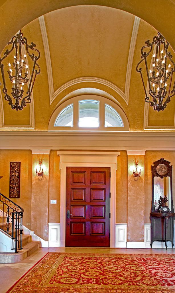 The elegant entryway of a Tuscan style home.