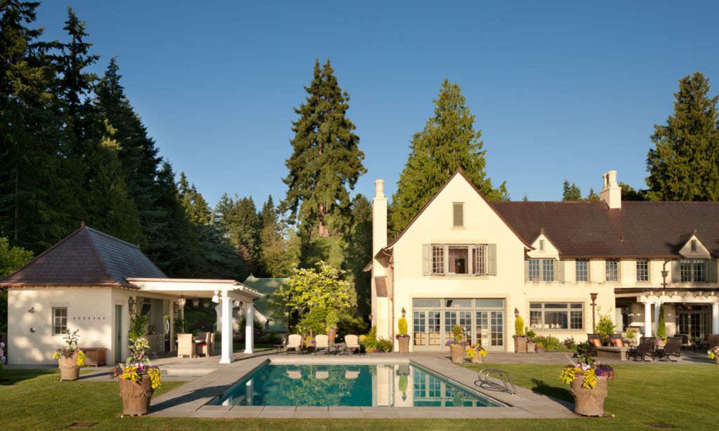 An outdoor pool at a traditional style home.