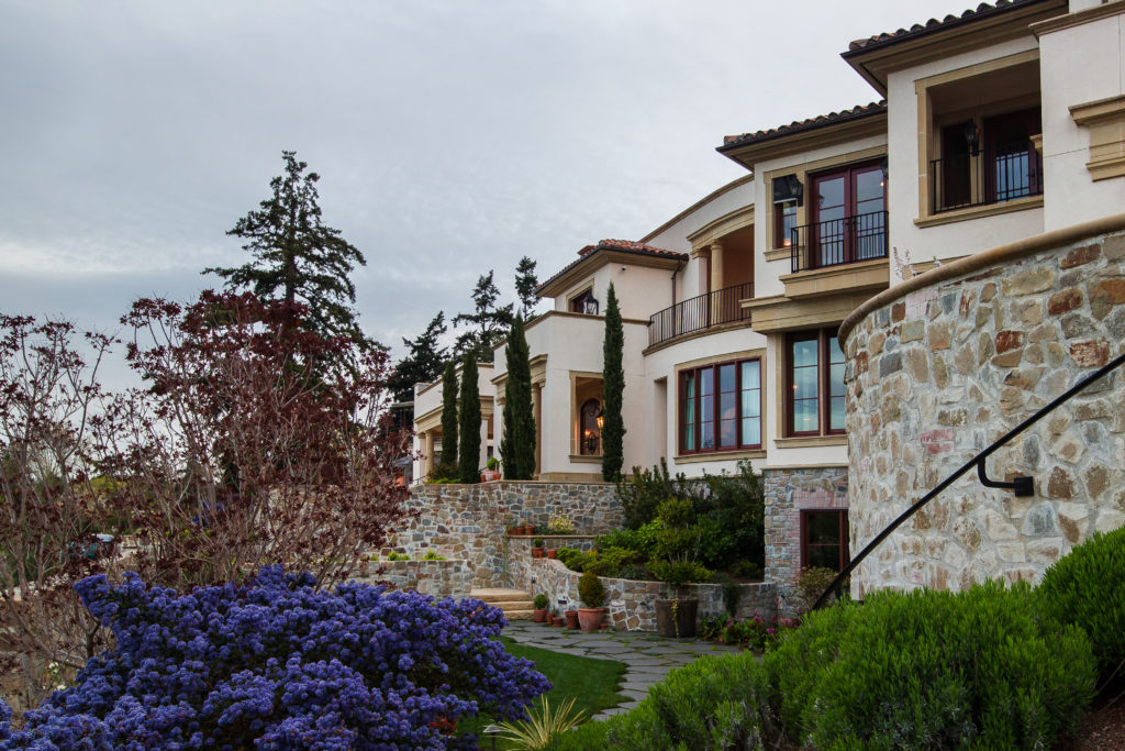 Tuscan style landscape architecture with sustainable foliage for luxury home design